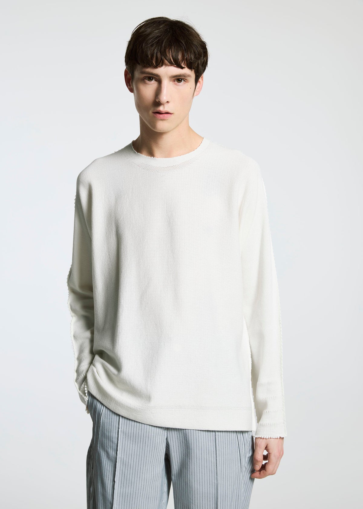 A model wears the A-Poc Able Issey Miyake TYPE S 001 3 trousers.