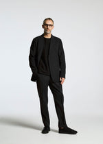 A model wears the A-Poc Able Issey Miyake TYPE ? 007 trousers.