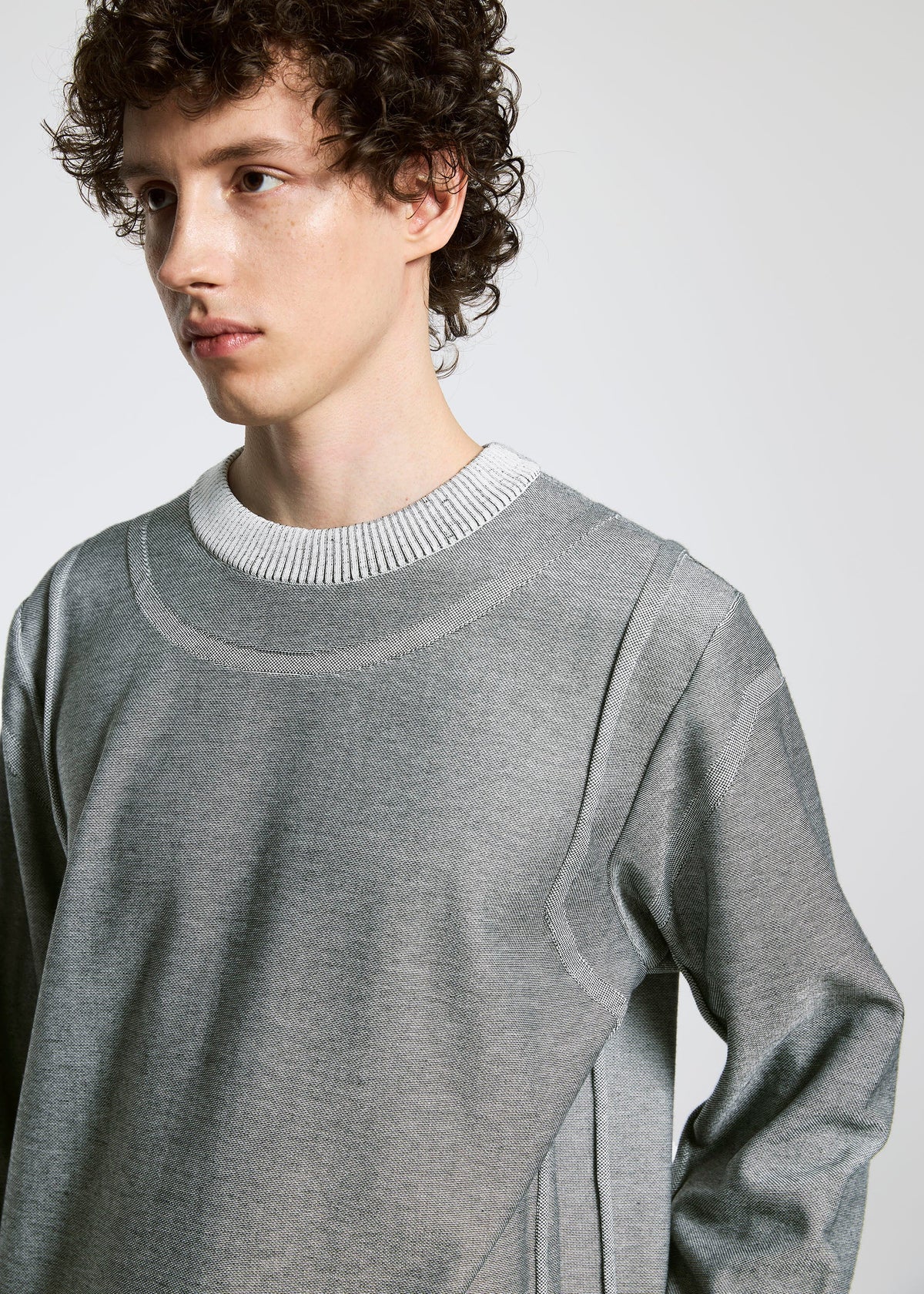 A model wears the A-POC ABLE ISSEY MIYAKE TYPE K 005 top.
