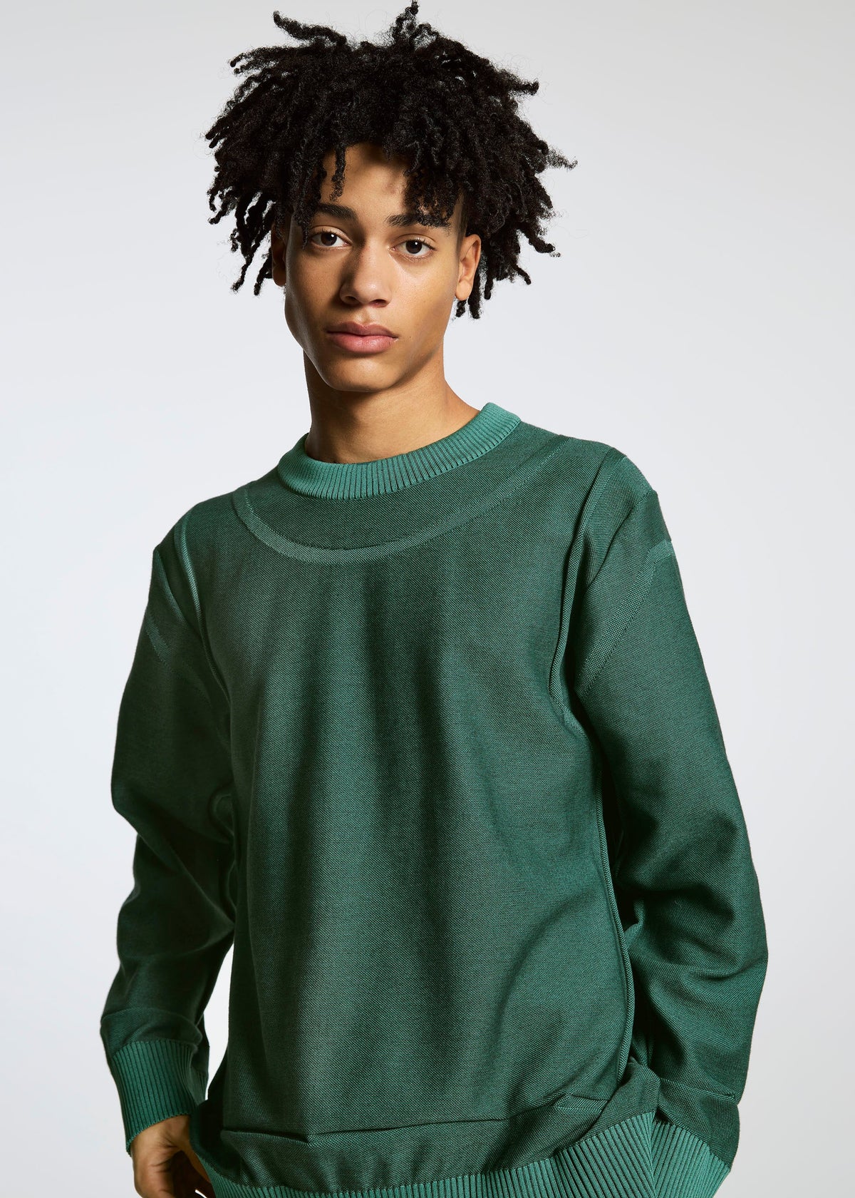 A model wears the A-POC ABLE ISSEY MIYAKE TYPE K 005 top.