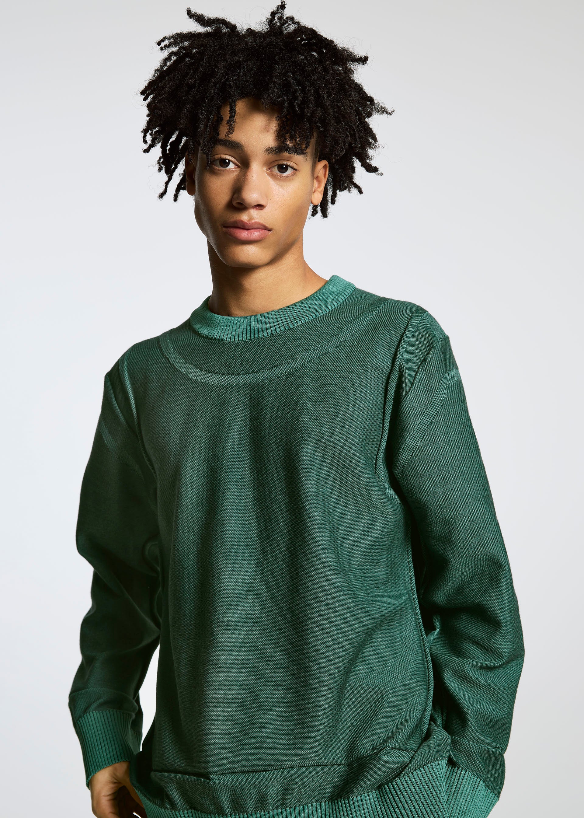 A model wears the A-POC ABLE ISSEY MIYAKE TYPE K 005 top.