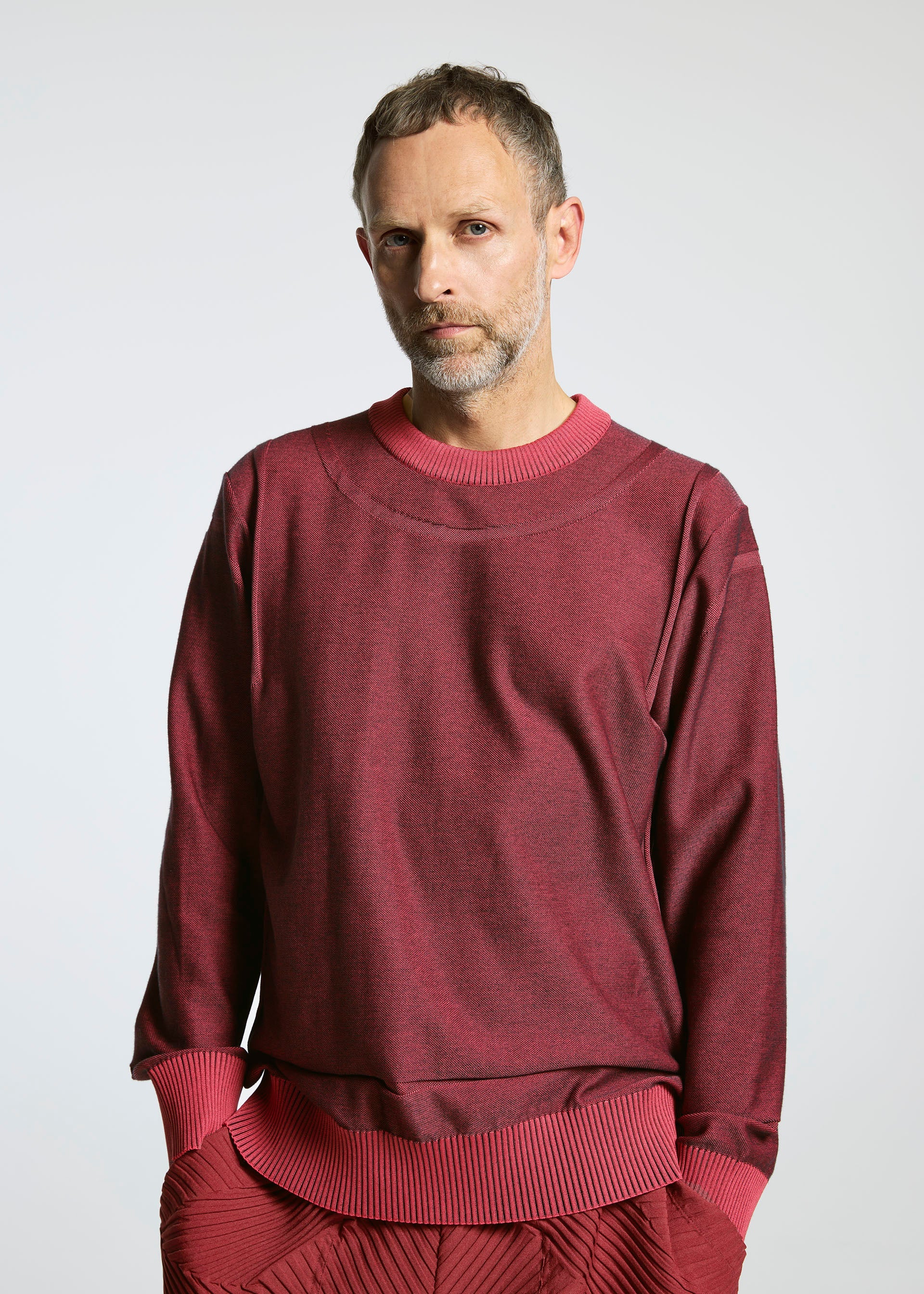 A model wears the A-POC ABLE ISSEY MIYAKE TYPE K 005 top.