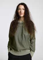 A model wears the A-POC ABLE ISSEY MIYAKE TYPE K 005 top.