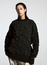 A model wears the APOCABLE TYPE K 007 prêt à porter.