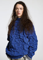 A model wears the APOCABLE TYPE K 007 prêt à porter.