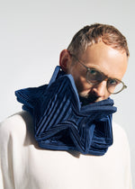 A model wears the A-POC ABLE ISSEY MIYAKE TYPE-O STOLE 002 type-o-stole-002-stole-black.
