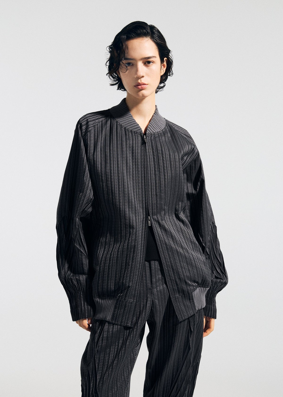 A model wears the A-Poc Able Issey Miyake TYPE S 001 1 blouson.