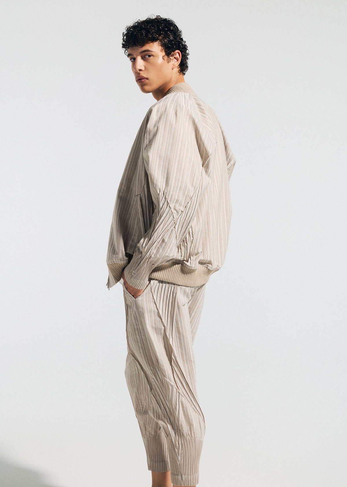A model wears the A-Poc Able Issey Miyake TYPE S 001 1 blouson.