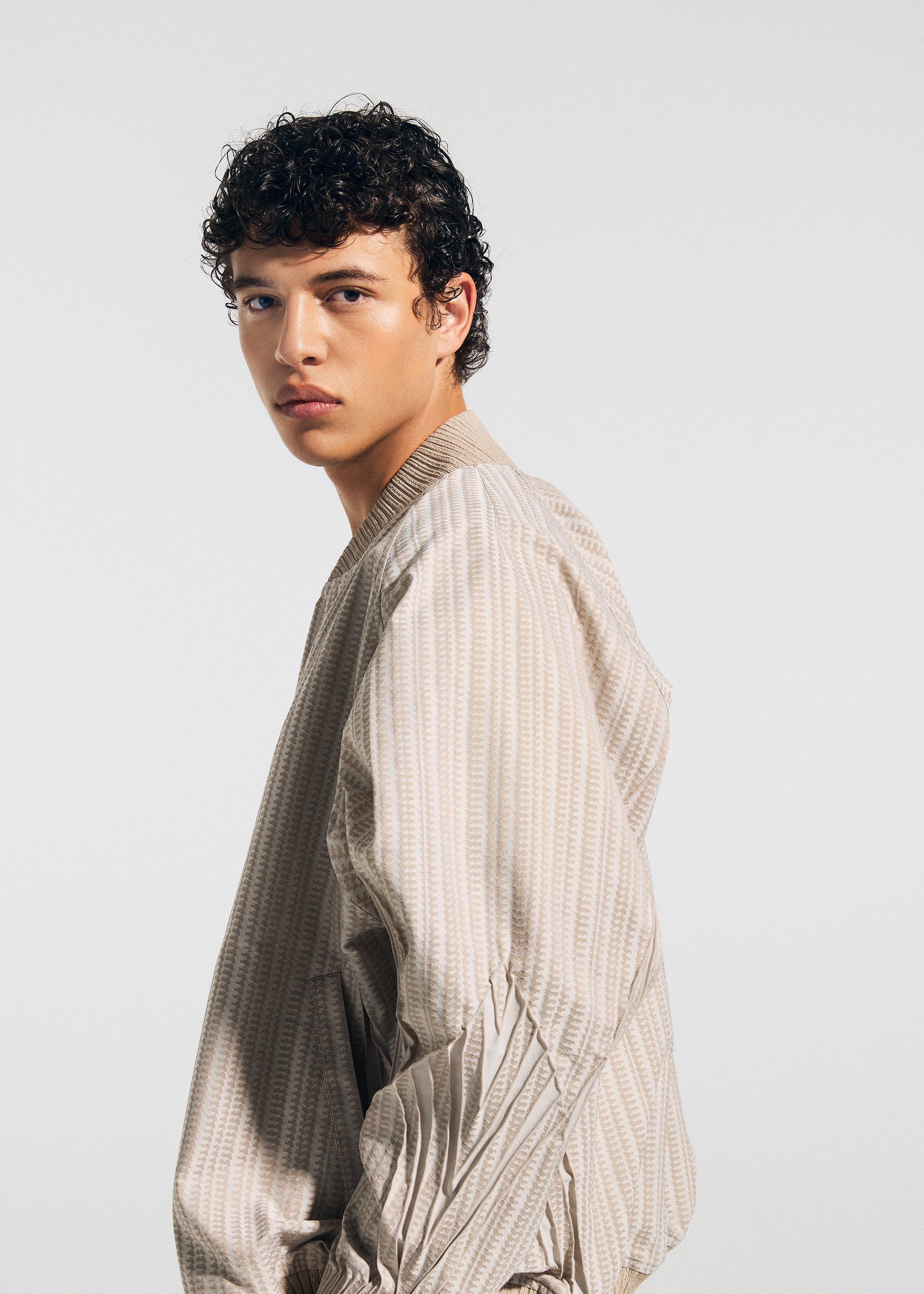 A model wears the A-Poc Able Issey Miyake TYPE S 001 1 blouson.