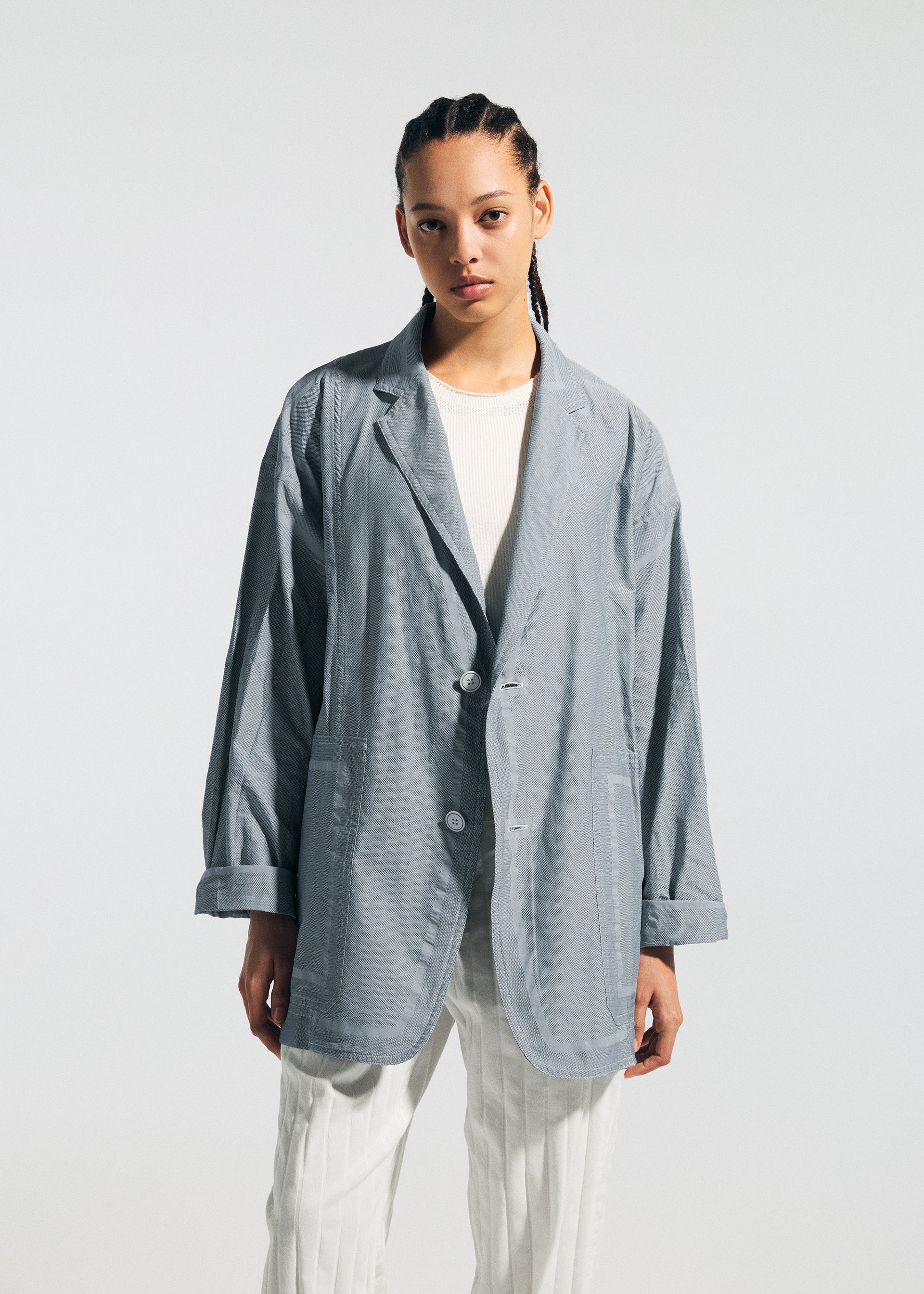 A model wears the A-Poc Able Issey Miyake TYPE U 002 jacket.