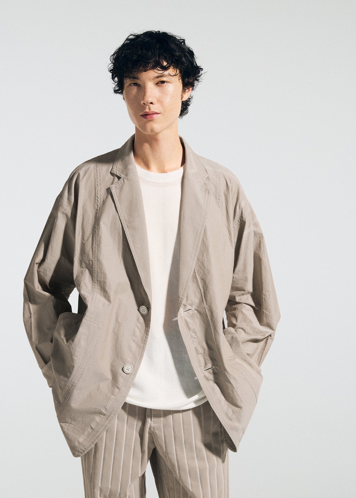A model wears the A-Poc Able Issey Miyake TYPE U 002 jacket.