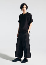 A model wears the A-Poc Able Issey Miyake TYPE W 009 1 pants.