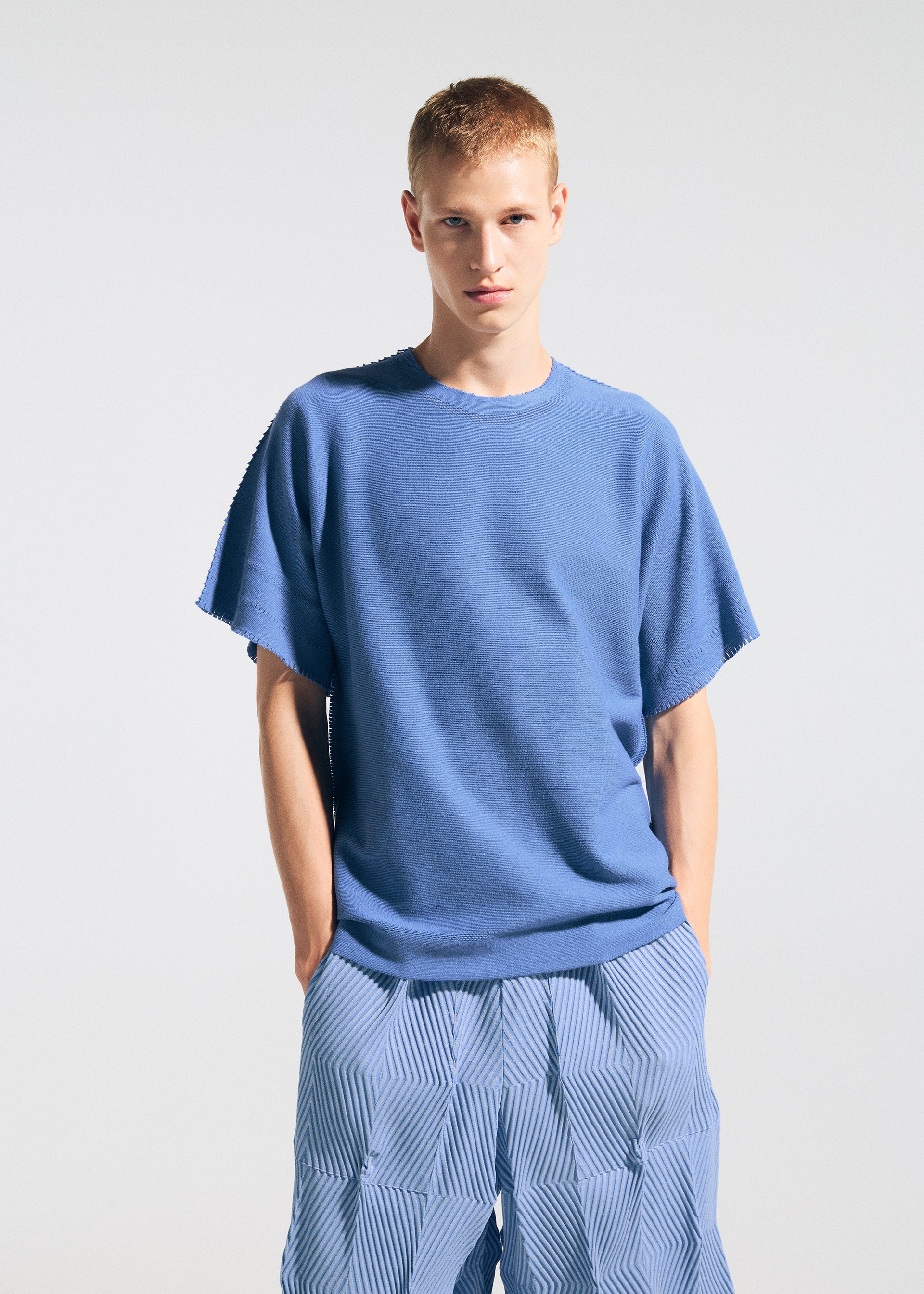 A model wears the A-Poc Able Issey Miyake TYPE W 009 1 pants.