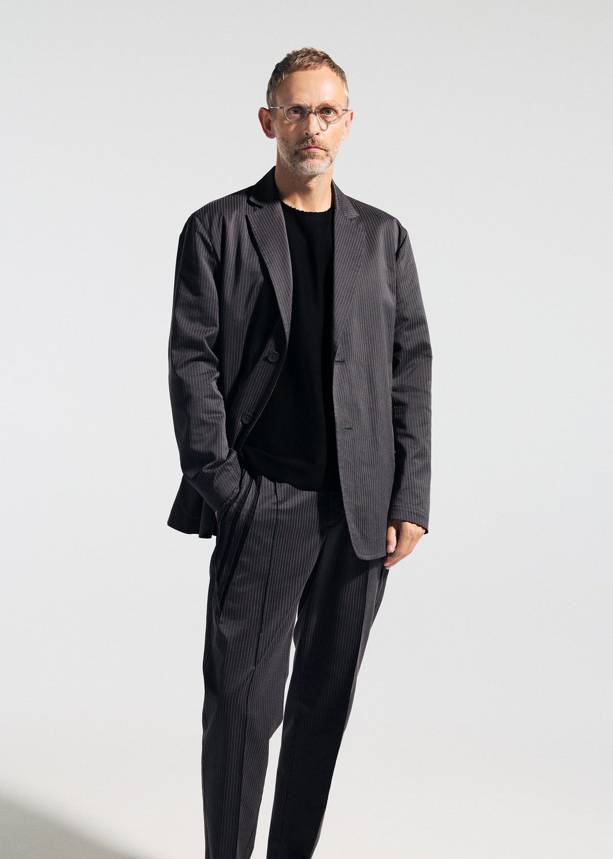 A model wears the A-POC ABLE ISSEY MIYAKE TYPE-S 001-2 type-s-001-2-pants-grey-hued.