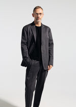 A model wears the A-POC ABLE ISSEY MIYAKE TYPE-S 001-2 type-s-001-2-pants-pink-beige-hued-1.