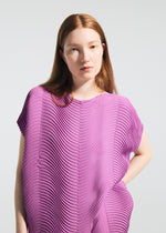 A model wears the A-POC ABLE ISSEY MIYAKE TYPE-P 006 type-p-006-skirt-pink-beige-2.
