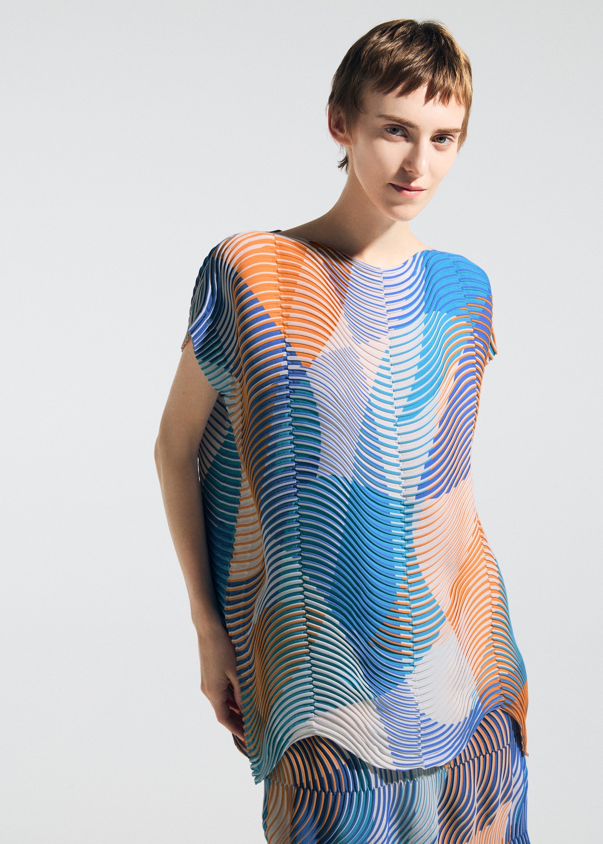 A model wears the A-POC ABLE ISSEY MIYAKE TYPE-P 005 type-p-005-shirt-turquoise-blue-hued-2.