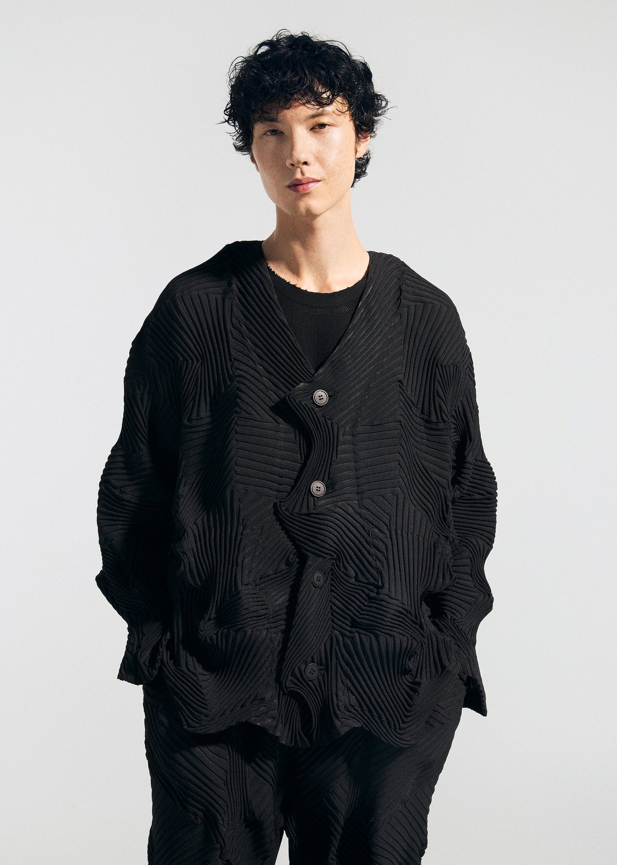 A model wears the A-Poc Able Issey Miyake TYPE P 003 1 cardigan.