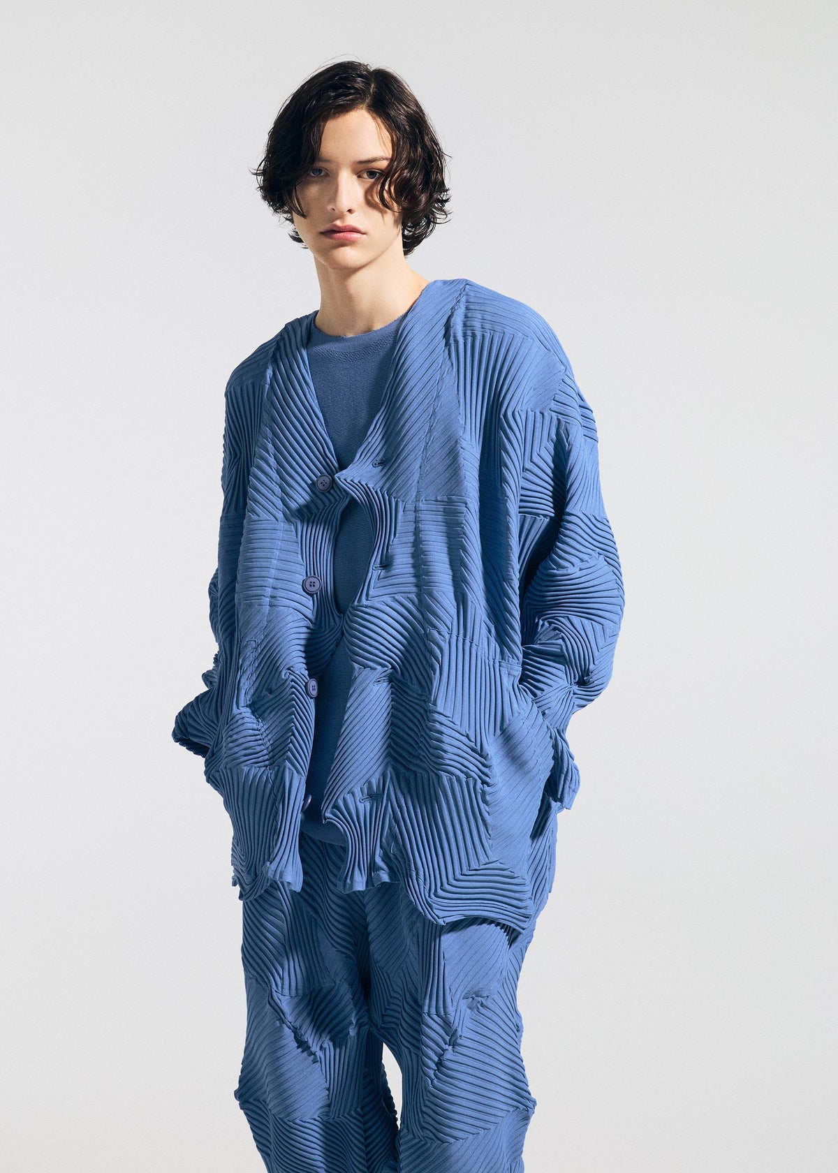 A model wears the A-Poc Able Issey Miyake TYPE P 003 1 cardigan.
