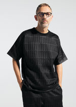 A model wears the A-Poc Able Issey Miyake TYPE E 001 shirt.