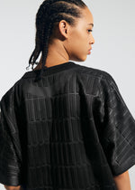 A model wears the A-Poc Able Issey Miyake TYPE E 001 shirt.