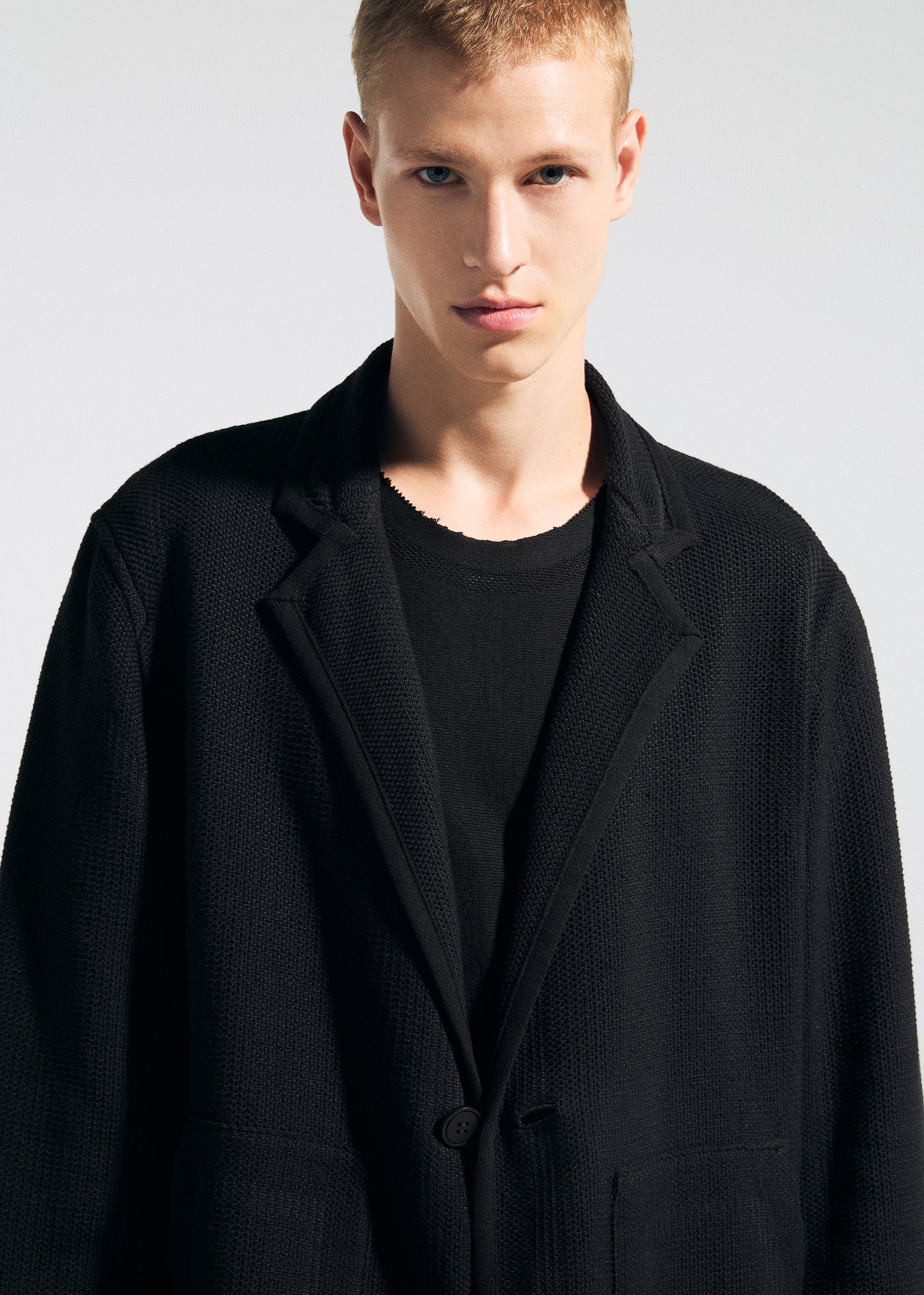 A model wears the A-Poc Able Issey Miyake TYPE K 008 jacket.