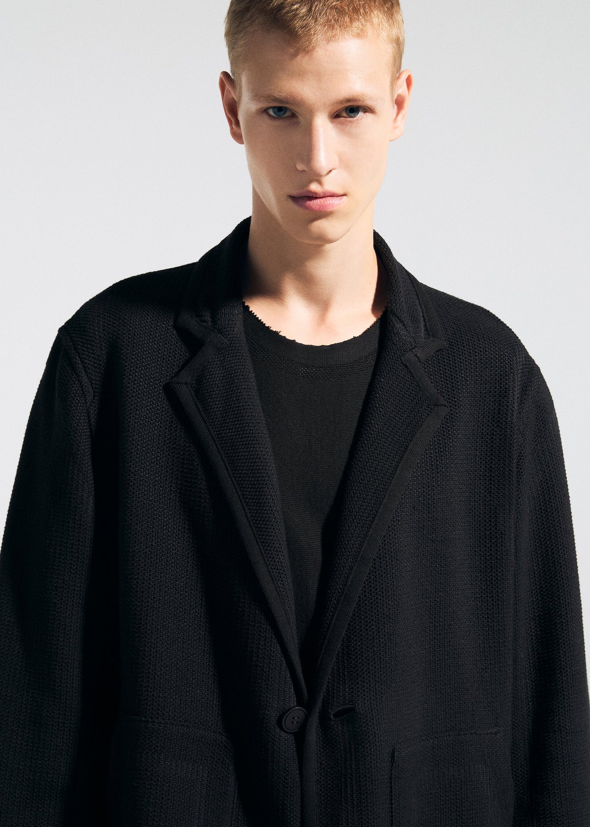 A model wears the A-Poc Able Issey Miyake TYPE K 008 jacket.