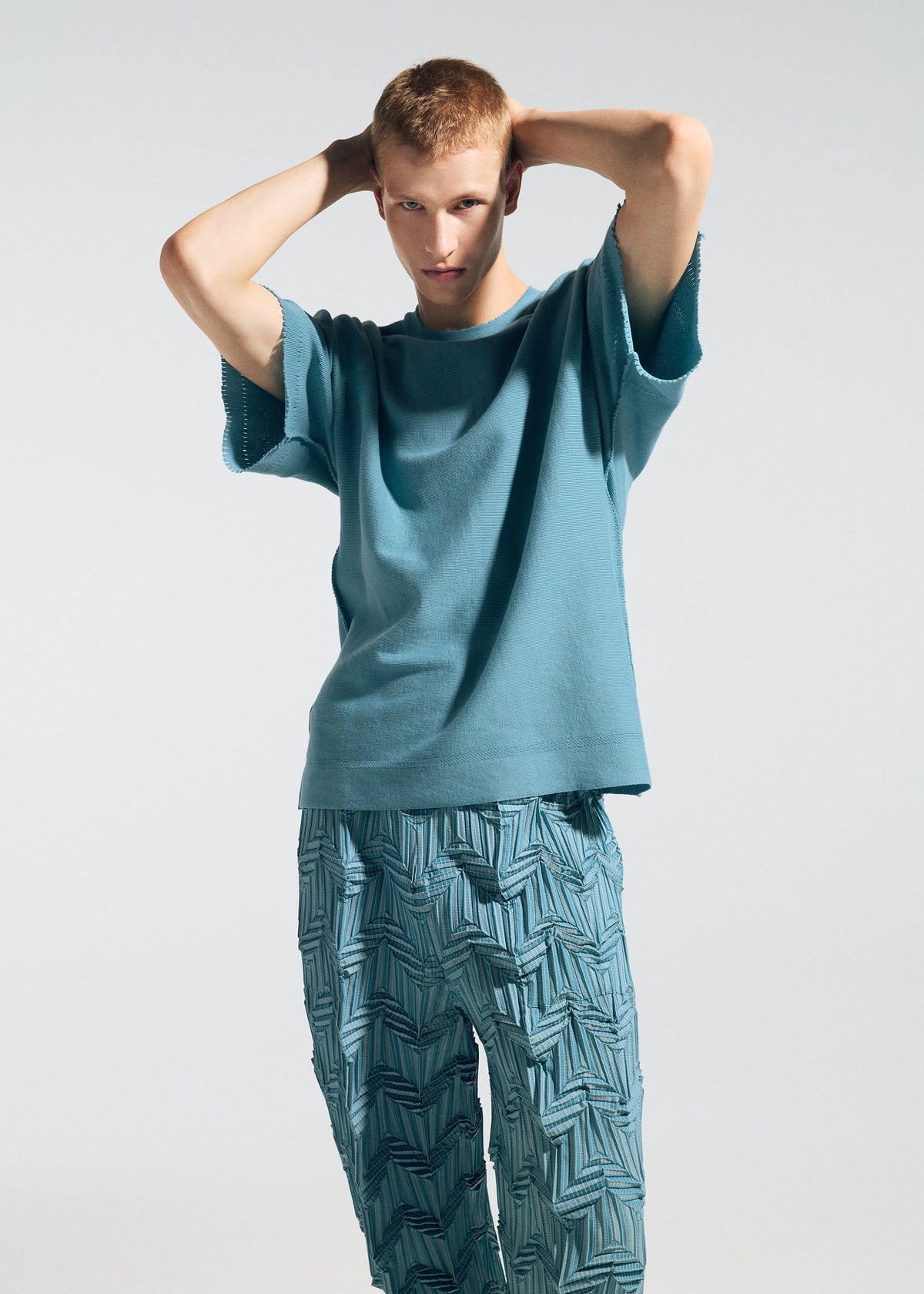A model wears the A-POC ABLE ISSEY MIYAKE TYPE-A 001-3 type-a-001-3-shirt-turquoise-blue-2.