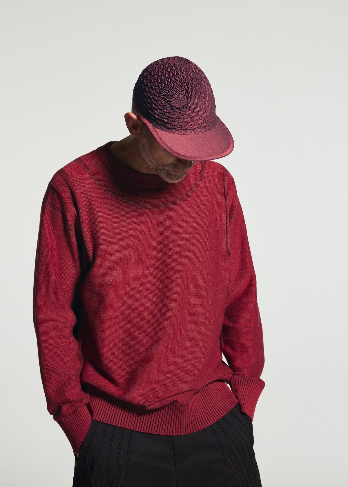 A model wears the A-POC ABLE ISSEY MIYAKE TYPE-O CAP cap.