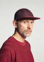 A model wears the A-POC ABLE ISSEY MIYAKE TYPE-O CAP cap.