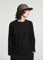 A model wears the A-POC ABLE ISSEY MIYAKE TYPE-O CAP cap.