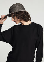 A model wears the A-POC ABLE ISSEY MIYAKE TYPE-O CAP cap.