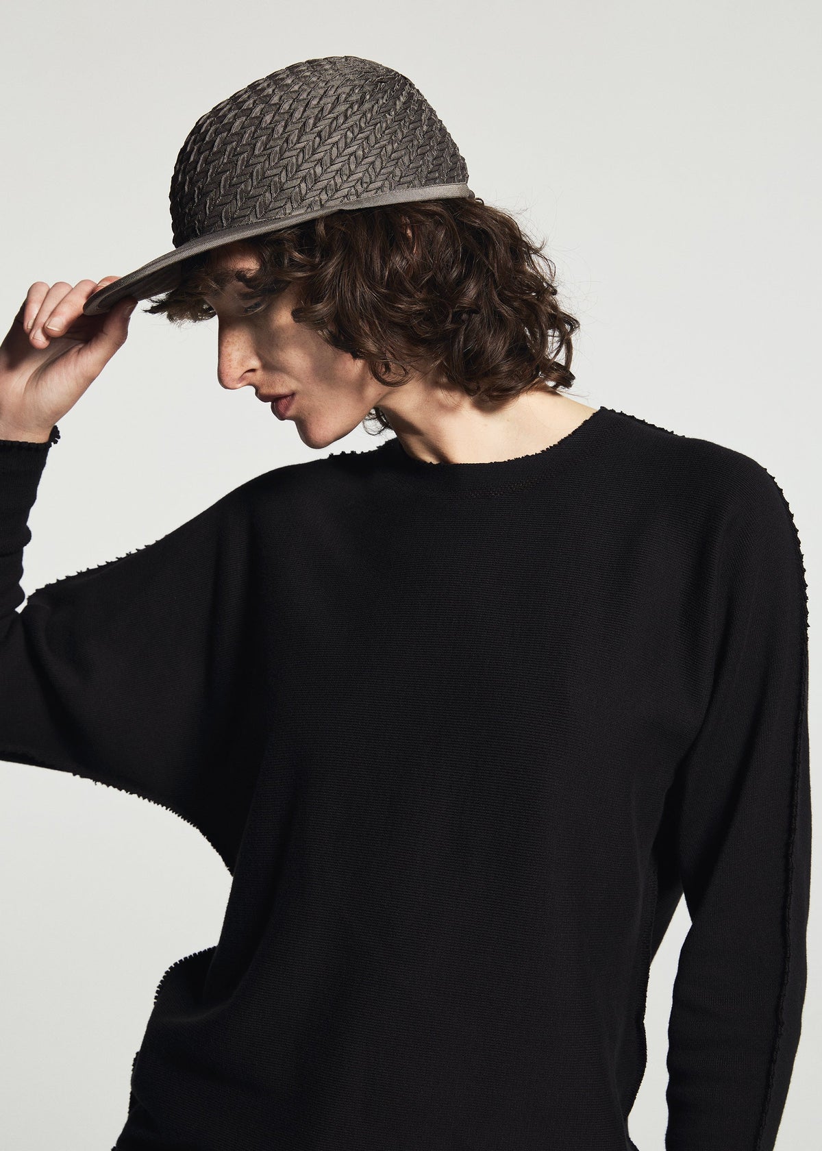 A model wears the A-POC ABLE ISSEY MIYAKE TYPE-O CAP cap.