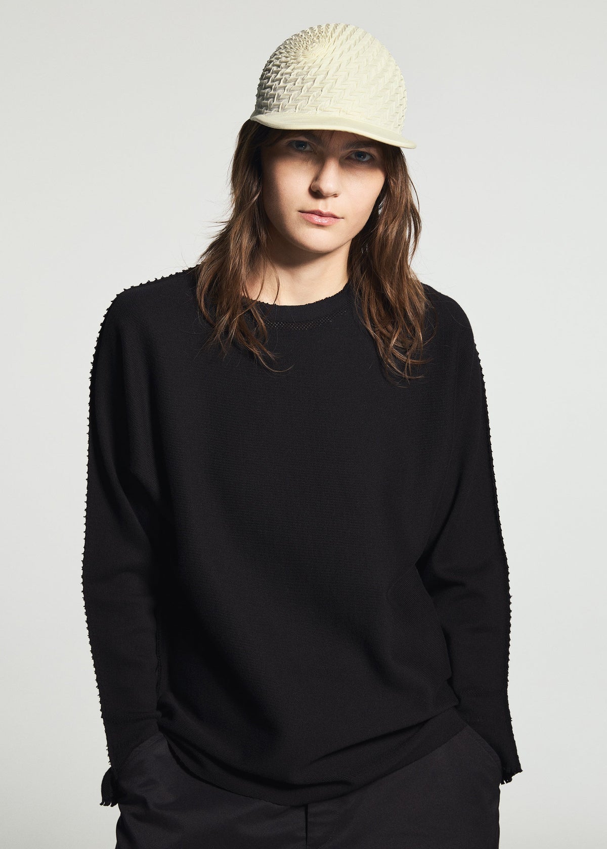 A model wears the A-POC ABLE ISSEY MIYAKE TYPE-O CAP cap.