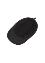 A detail shot of the A-POC ABLE ISSEY MIYAKE TYPE-O CAP cap.