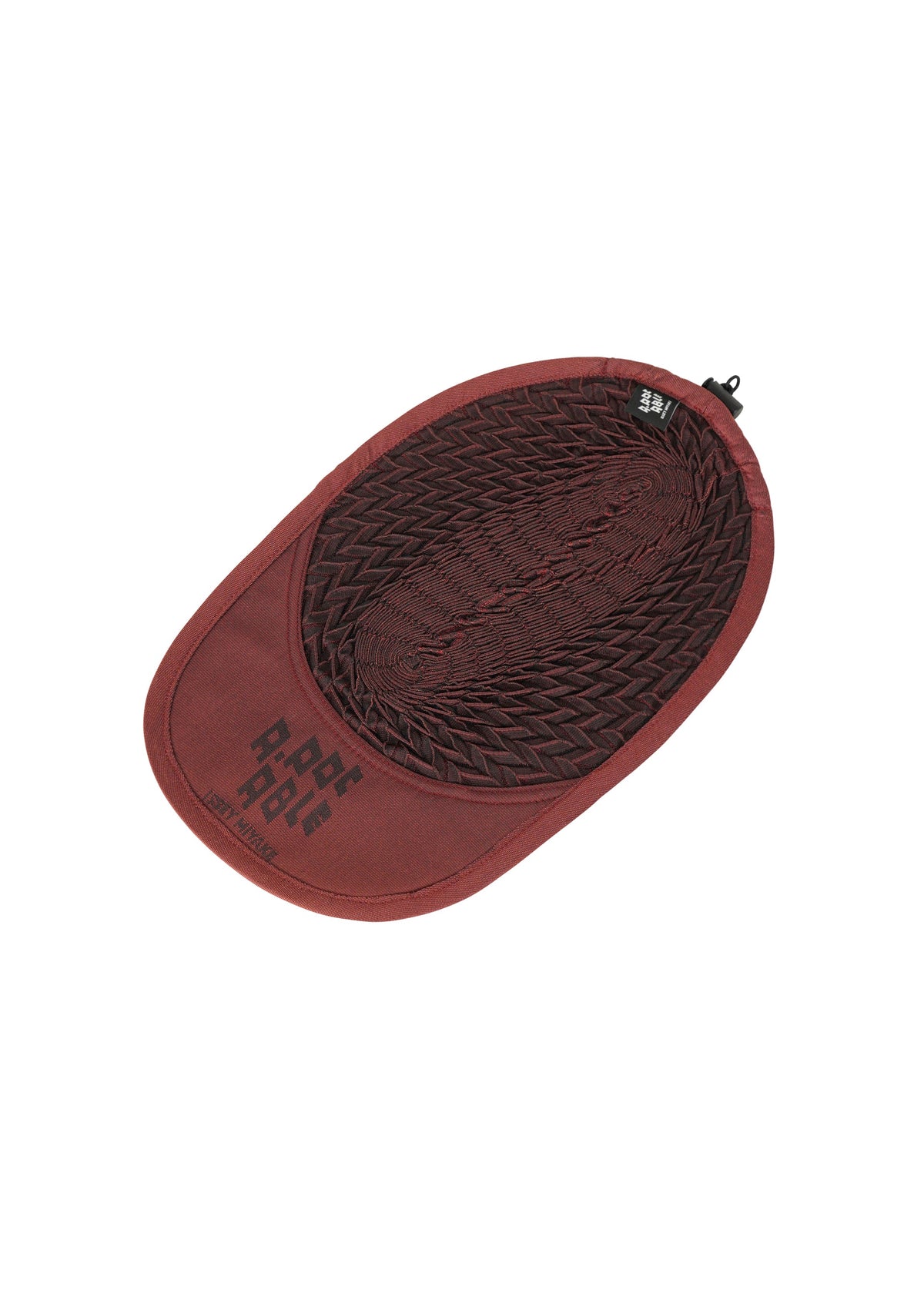 A detail shot of the A-POC ABLE ISSEY MIYAKE TYPE-O CAP cap.
