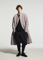 A model wears the A-POC ABLE ISSEY MIYAKE TYPE-O 024 coat.