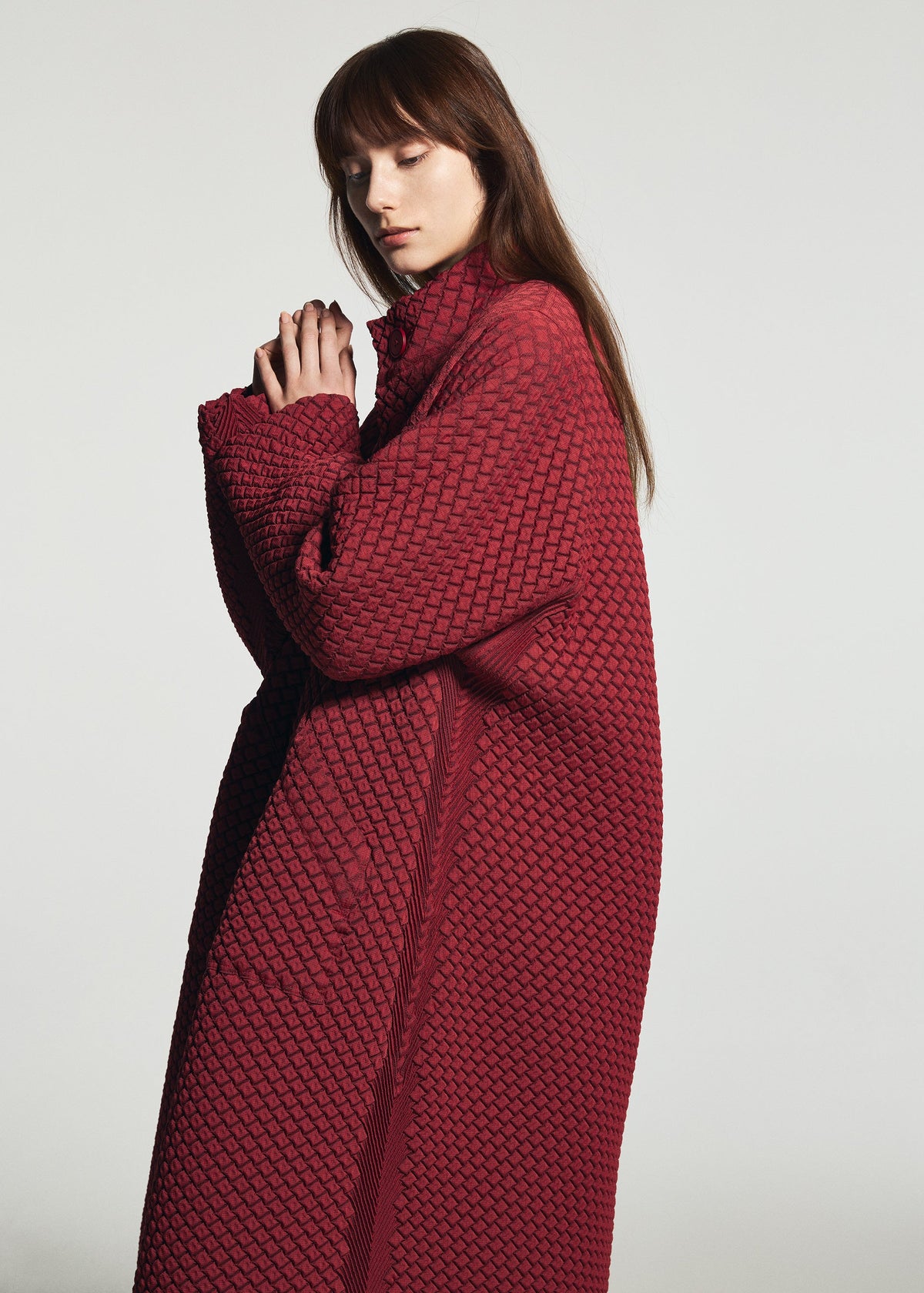 A model wears the A-POC ABLE ISSEY MIYAKE TYPE-O 024 coat.