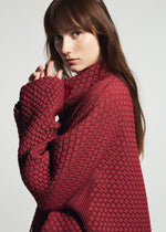 A model wears the A-POC ABLE ISSEY MIYAKE TYPE-O 024 coat.