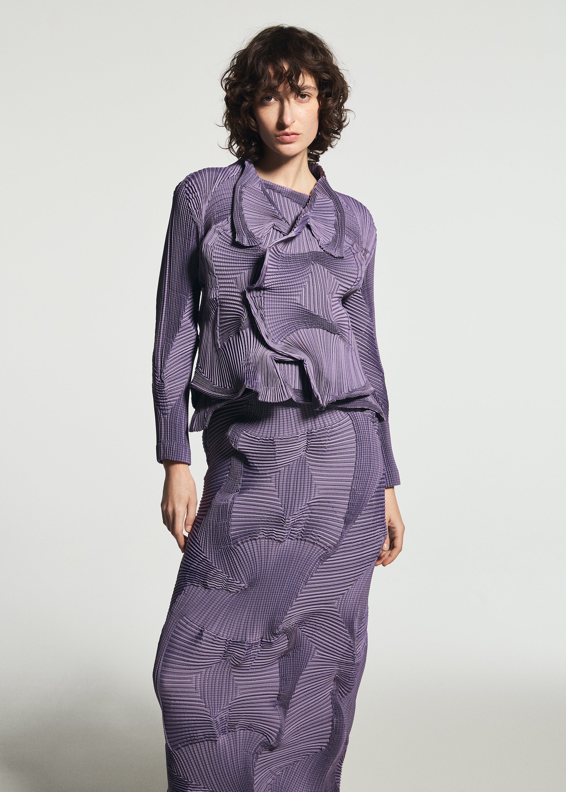 A model wears the A-POC ABLE ISSEY MIYAKE TYPE-O 003-1 jacket.