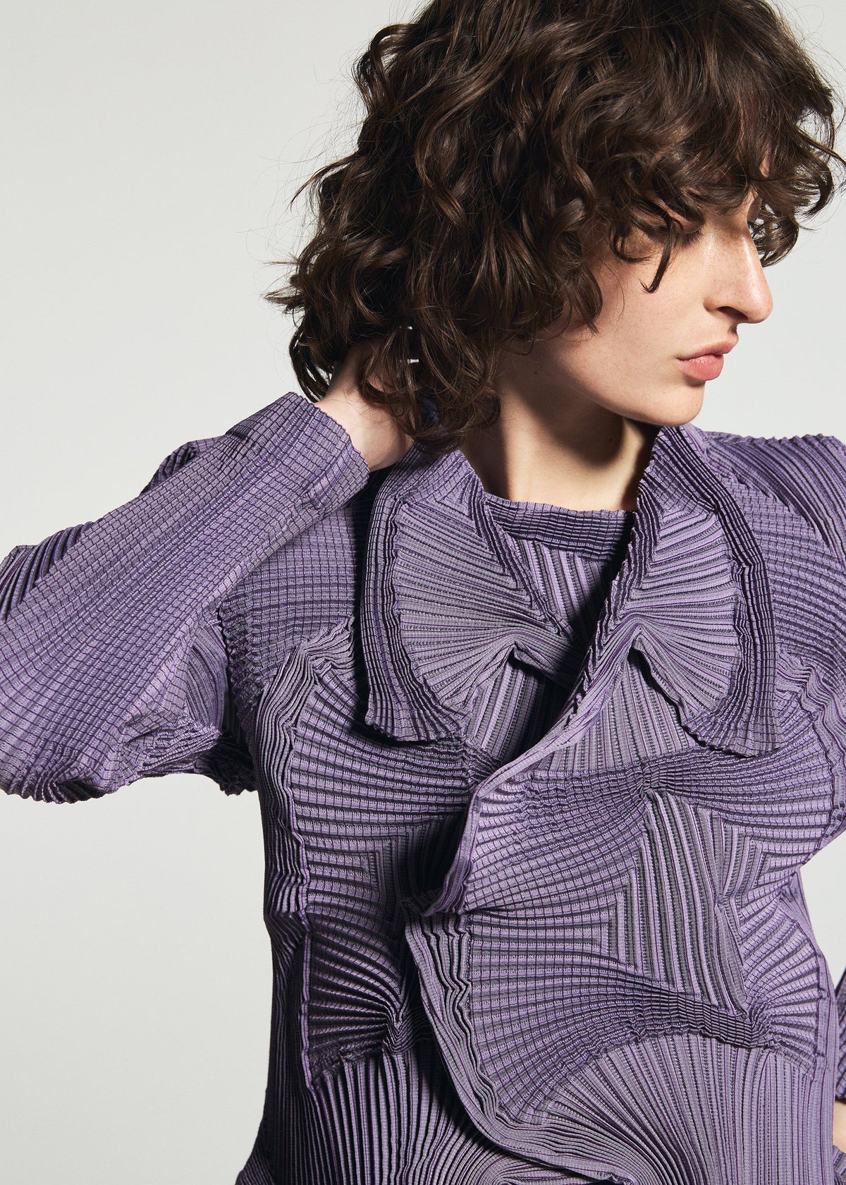 A model wears the A-POC ABLE ISSEY MIYAKE TYPE-O 003-1 jacket.