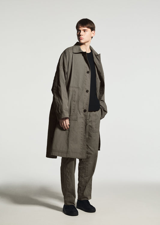 A model wears the A-POC ABLE ISSEY MIYAKE TYPE-U 001-1 trousers.