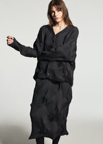 A model wears the A-POC ABLE ISSEY MIYAKE TYPE-O 010-1 cardigan.