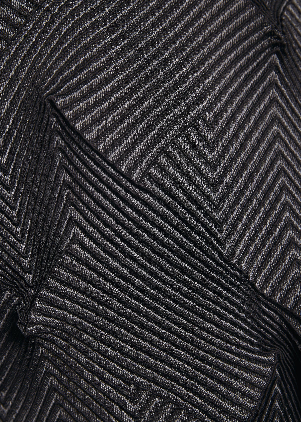 A model wears the A-POC ABLE ISSEY MIYAKE TYPE-O 010-1 cardigan.