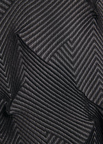 A model wears the A-POC ABLE ISSEY MIYAKE TYPE-O 010-1 cardigan.