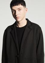 A model wears the A-POC ABLE ISSEY MIYAKE TYPE-K 012 jacket.