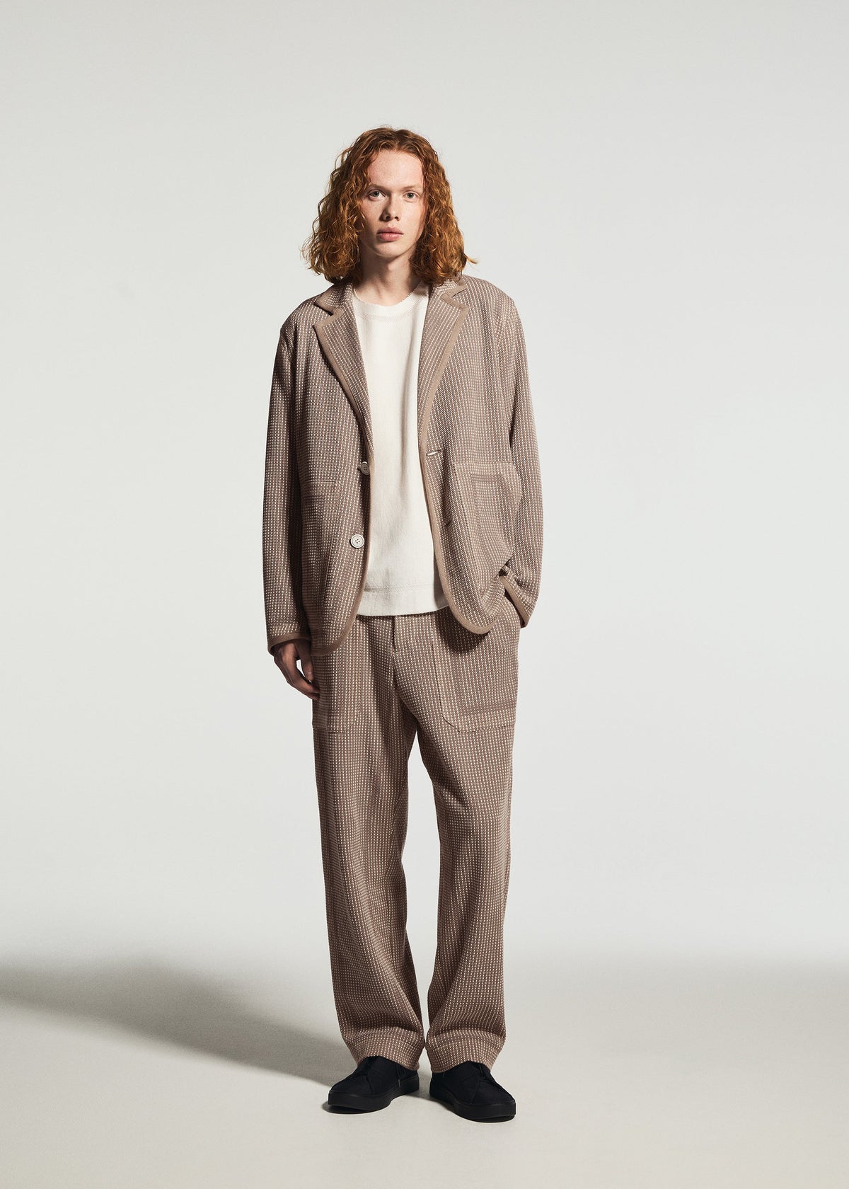 A model wears the A-POC ABLE ISSEY MIYAKE TYPE-K 012 trousers.