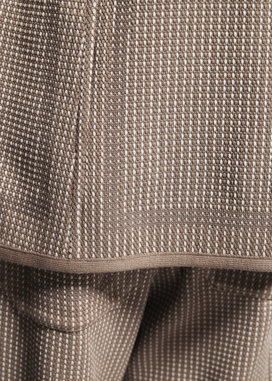 A model wears the A-POC ABLE ISSEY MIYAKE TYPE-K 012 trousers.