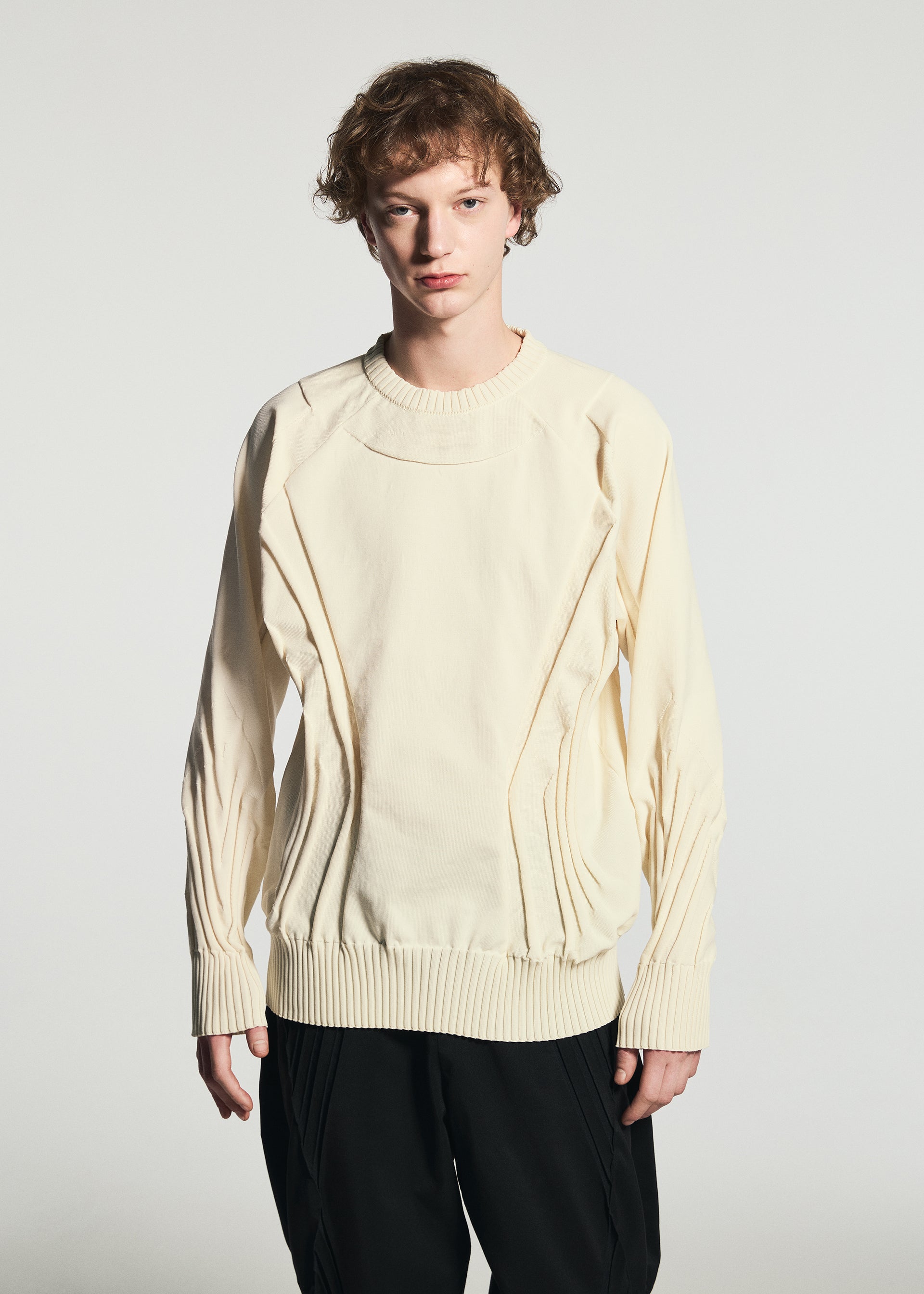 A model wears the A-POC ABLE ISSEY MIYAKE TYPE-K 001 top.