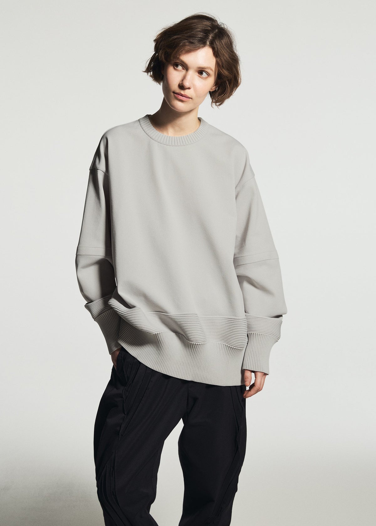 A model wears the A-POC ABLE ISSEY MIYAKE TYPE-K 009 top.